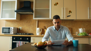 Homeowner reviewing HOA financial documents for a forensic audit request